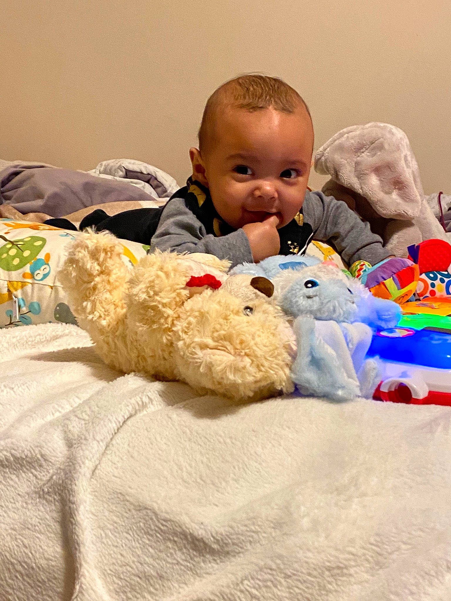 William Jr is registered to the contest to win money with this photo: baby, baby_toys, child, head, person, play, plush, room, skin, stuffed_toy, teddy_bear, toddler, toy