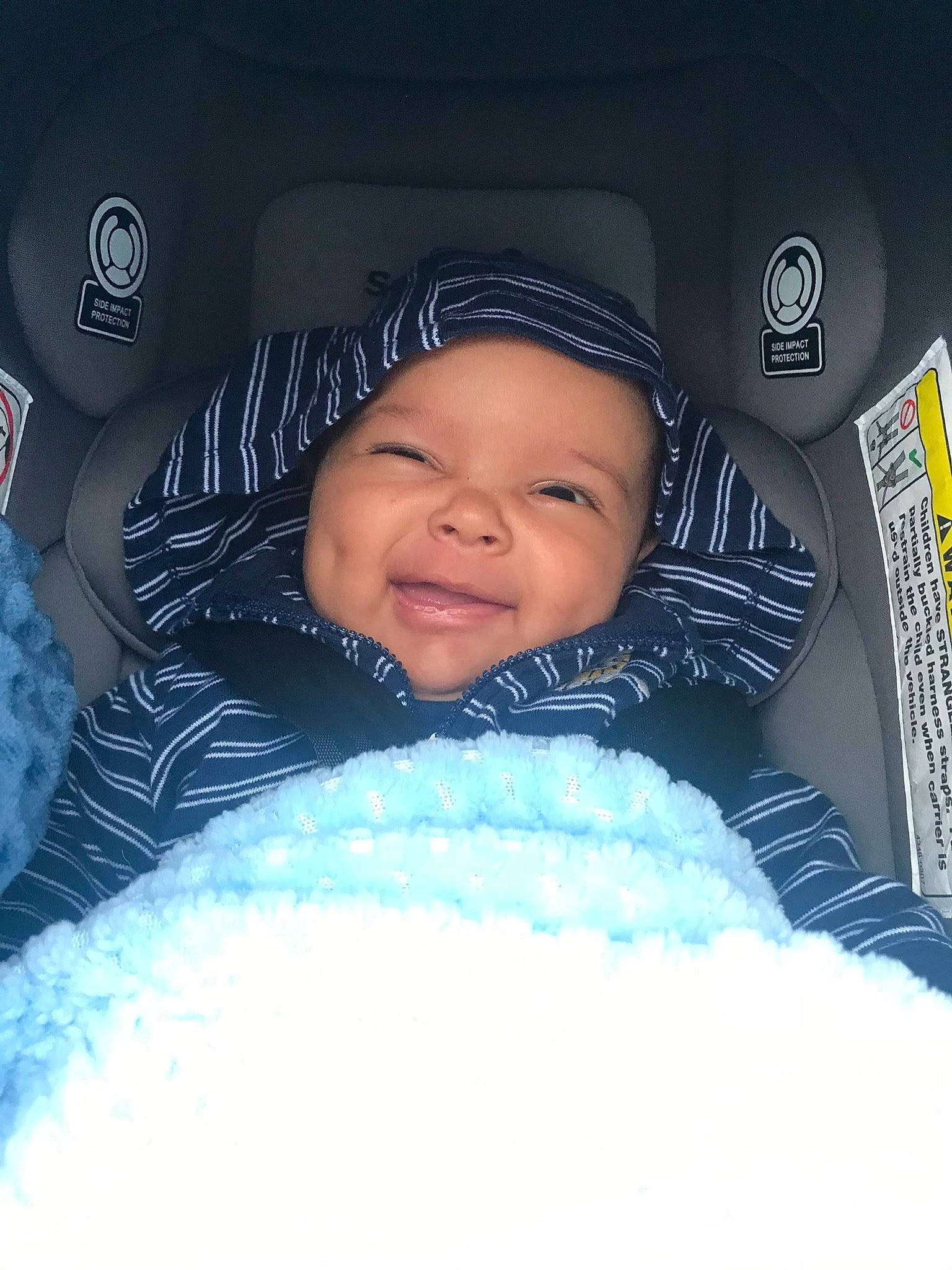 William Jr is registered to the contest to win money with this photo: baby, beanie, bonnet, cheek, child, cloud, cool, eye, face, facial_expression, fun, happy, head, headgear, headwear, person, product, skin, sleep, smile