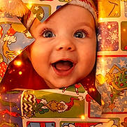 Henry is registered to the contest to win money with this photo: baby, child, face, smile, christmas, wrapping_paper, holiday, grinch, star_shaped_cutout, festive, cute, joyful, glowing_lights, celebration, colorful, closeup, happy, holiday_decor, infant, cheerful