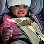 Maddison joined the competition — help win amazing prizes! baby, child, car_seat, hat, pink_sweater, blanket, seatbelt, infant, cute, portrait, indoors, car_interior, smiling, face, hand, warm_clothing, cozy, seat, straps, young_child