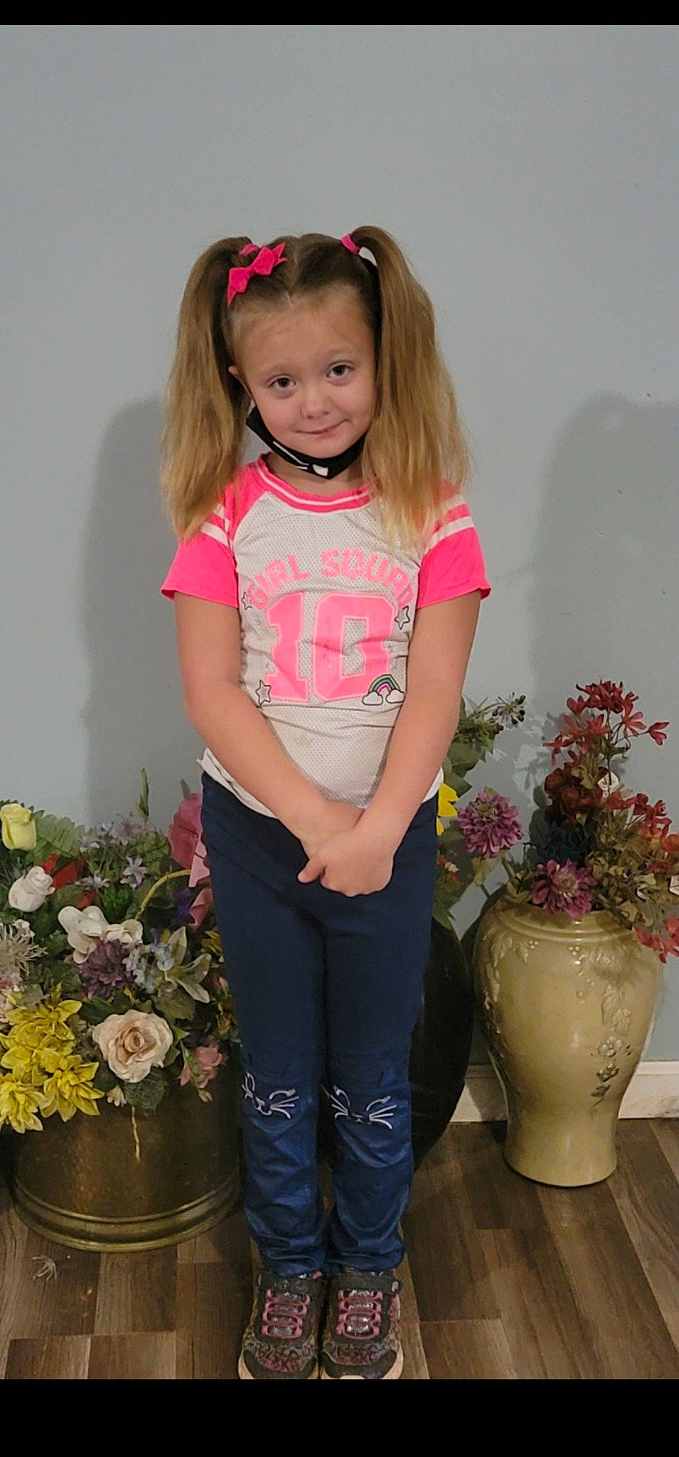 Lillianna is registered to the contest to win money with this photo: baby_toddler_clothing, flower, flowerpot, hairstyle, happy, houseplant, iris, jeans, joy, knee, organ, person, photograph, pink, plant, red, shoulder, sleeve, standing, thigh