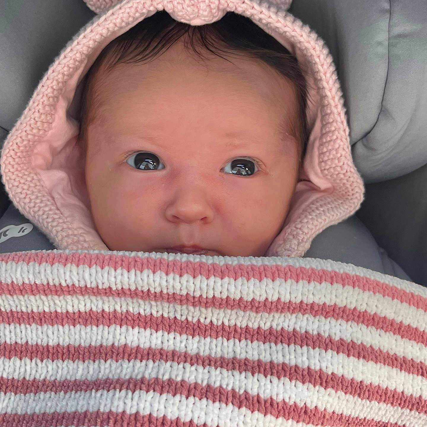 Ila is registered to the contest to win money with this photo: baby, blanket, bonnet, cap, clothing, coat, cushion, face, happy, hat, head, homedecor, hood, knitwear, newborn, person, photography, portrait, smile, sweater