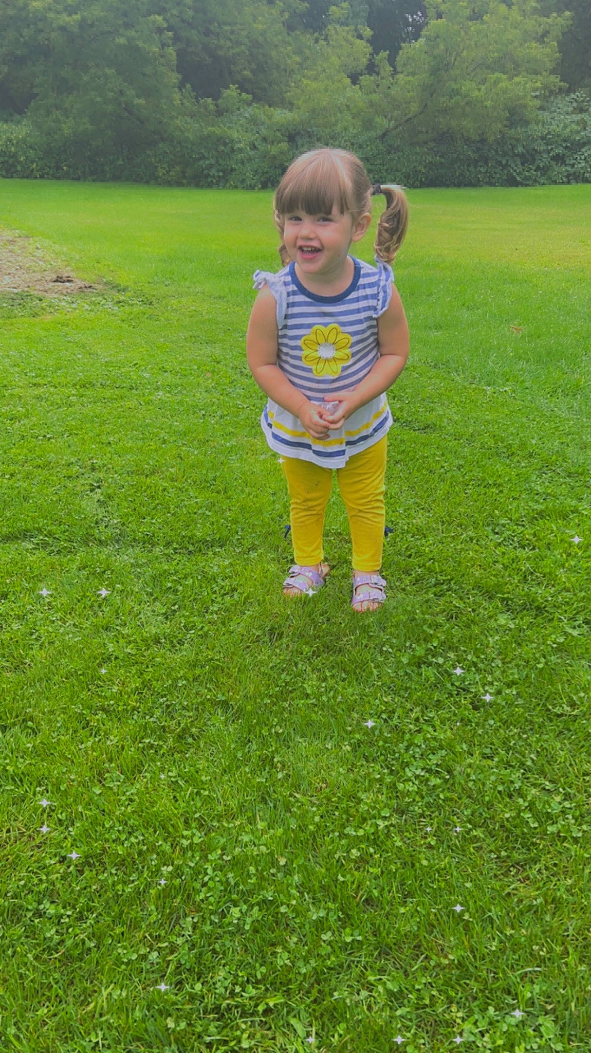 Amara is registered to the contest to win money with this photo: baby, baby_toddler_clothing, child, fun, grass, grassland, groundcover, happy, joy, landscape, lawn, leisure, meadow, people_in_nature, person, plant, recreation, shrub, sleeve, smile