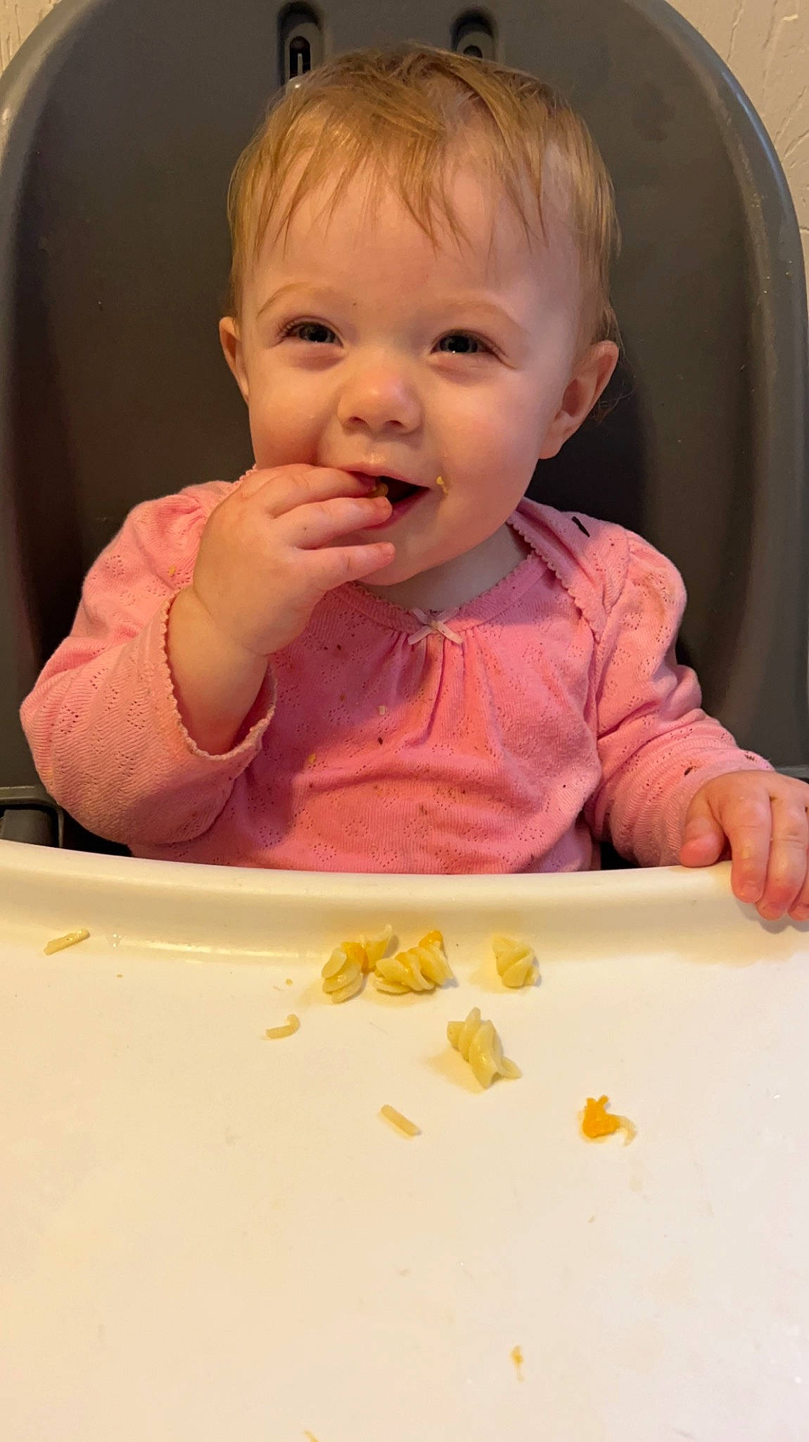 Esme is registered to the contest to win money with this photo: baby, baby_playing_with_food, baby_products, baby_toddler_clothing, chair, cheek, child, face, finger, food, food_craving, lip, mouth, nose, person, product, skin, smile, sweetness, tableware