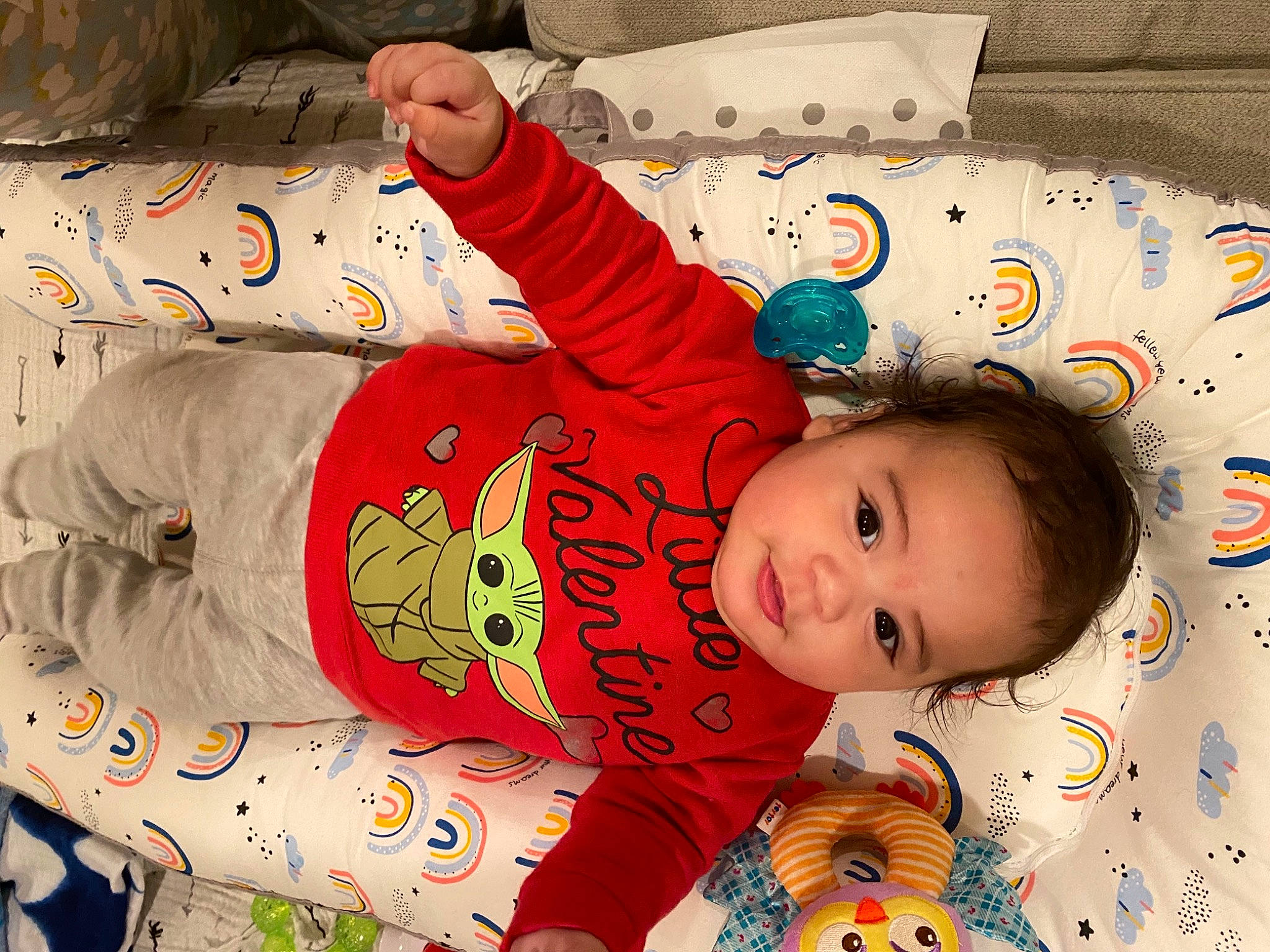 Fernando is registered to the contest to win money with this photo: baby, baby_toddler_clothing, cheek, child, christmas, christmas_eve, comfort, facial_expression, happy, holiday, linens, pattern, person, play, product, room, sleeve, smile, textile, toddler