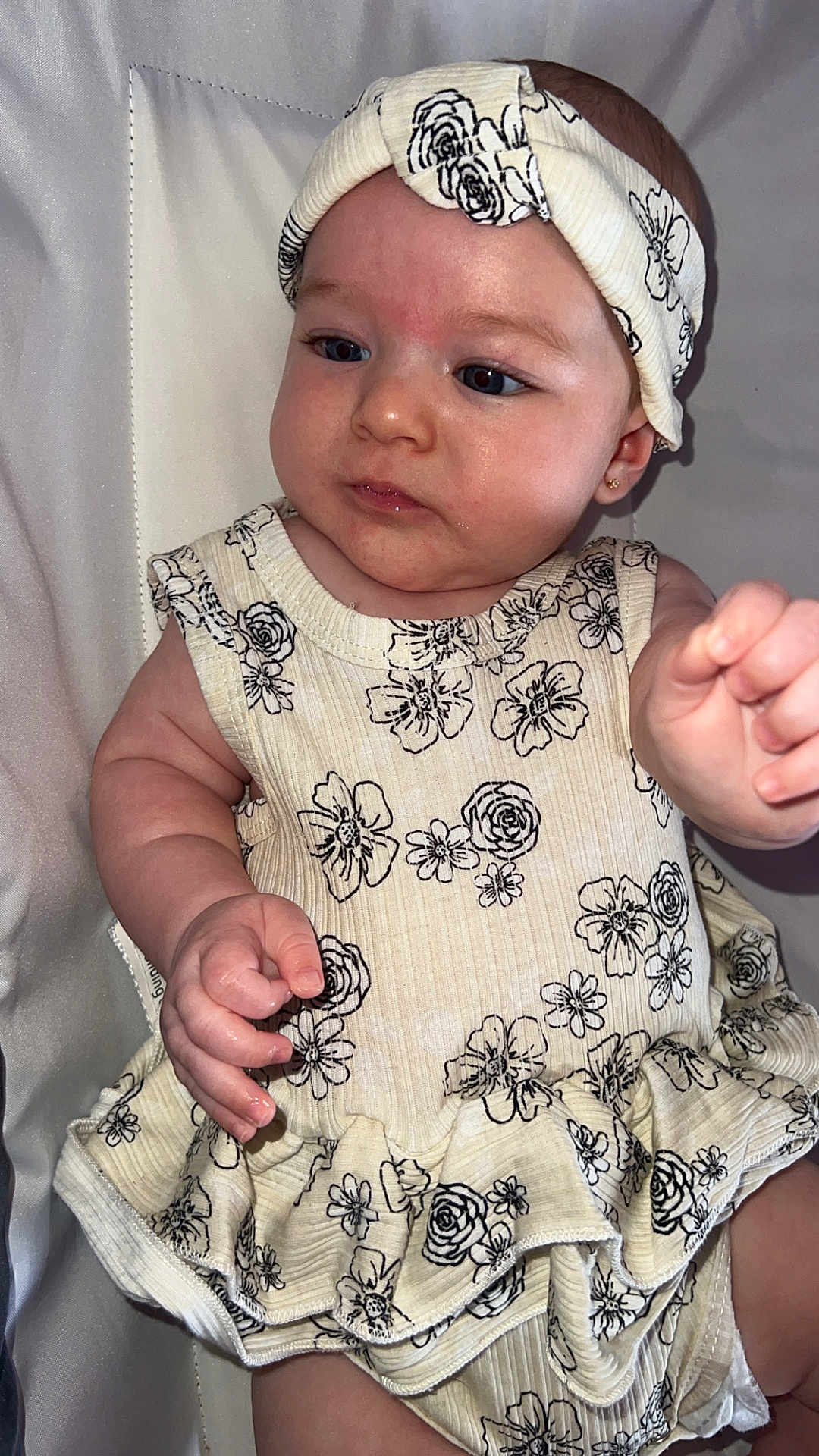 Giavanna joined the competition — help win amazing prizes! baby, child, infant, headband, dress, floral_pattern, hand, face, skin, earrings, cute, portrait, sitting, clothing, fabric, person, indoor, light, expression, young