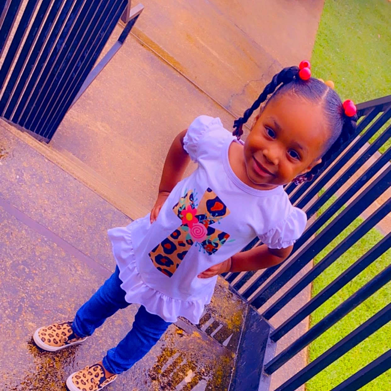 Saniyah joined the competition — help win amazing prizes! baby, baby_toddler_clothing, cool, electric_blue, floor, flooring, grass, happy, joy, leg, leisure, magenta, person, purple, sandal, shoe, sleeve, smile, sneakers, t_shirt