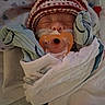 baby, bed, blanket, child, clothing, cozy, cute, face, hospital, indoors, infant, knit_hat, medical_tube, newborn, pacifier, resting, sleeping, soft, tiny, wrapped