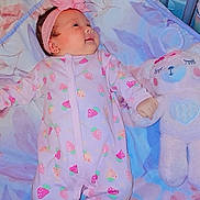 Valentina joined the competition — help win amazing prizes! baby, infant, onesie, strawberry_pattern, headband, flower, blanket, crib, teddy_bear, stuffed_animal, cute, sleeping, child, soft_toy, pink, purple, floral, bed, peaceful, hand_holding