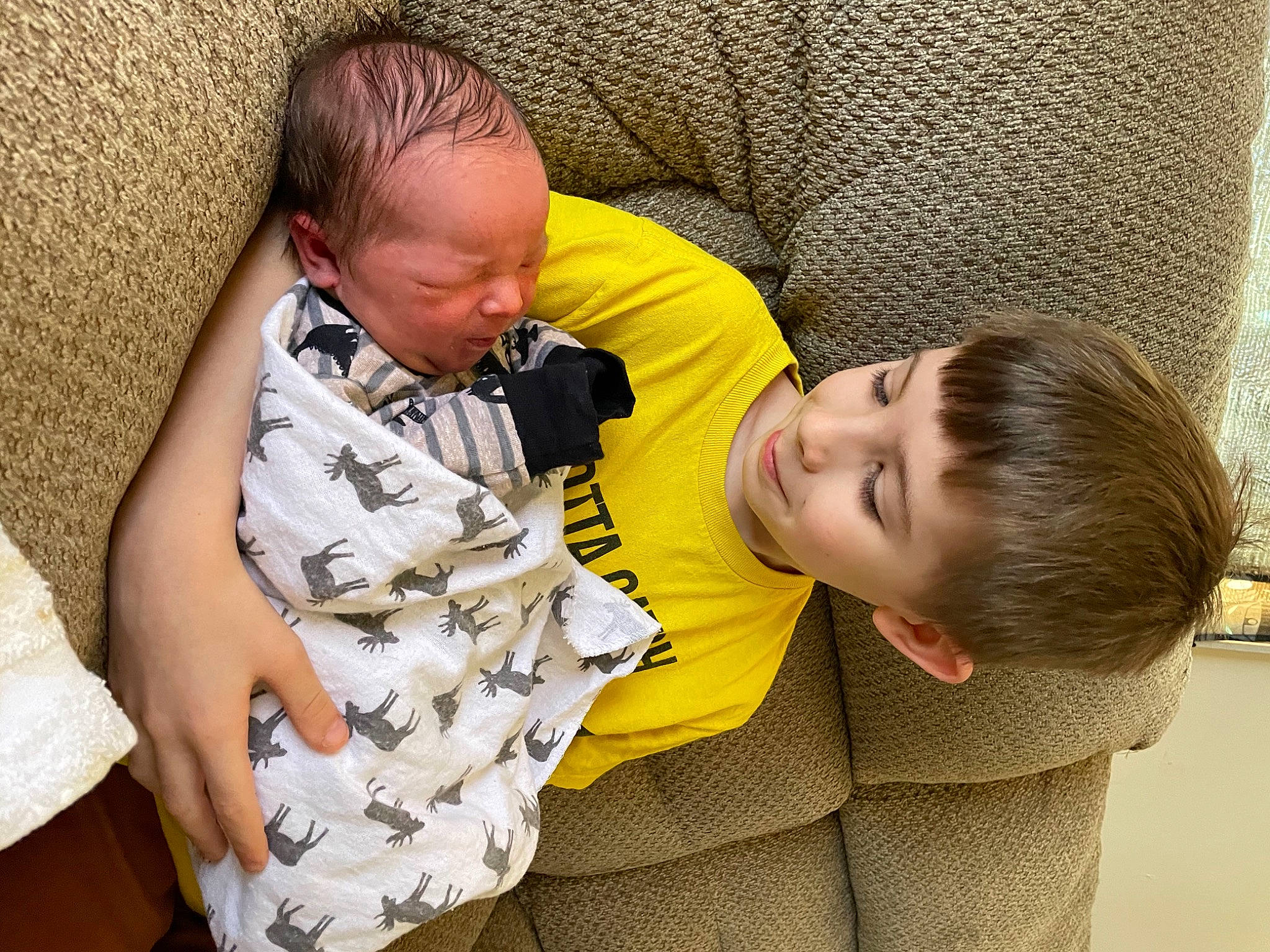 Cade is registered to the contest to win money with this photo: baby, bedtime, child, comfort, couch, event, flooring, fun, grass, happy, human, joy, lap, leisure, nap, person, play, room, sitting, sleep