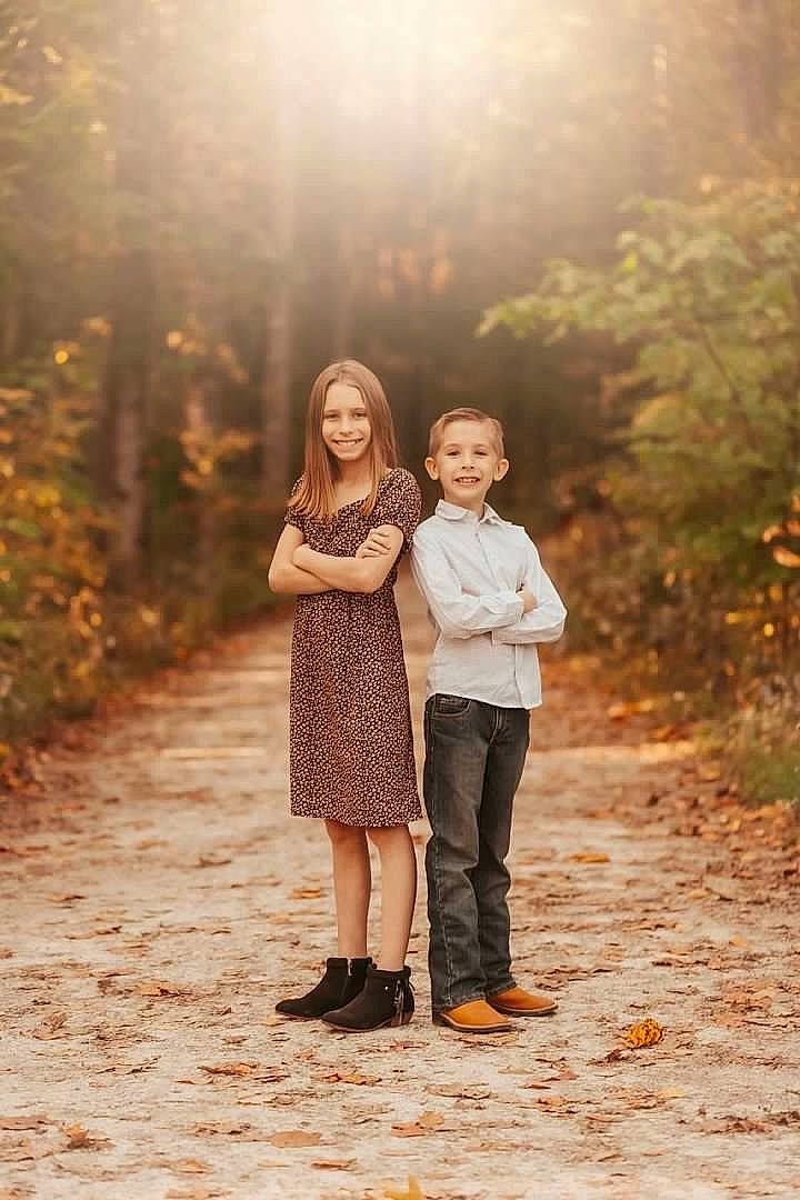 Ali is registered to the contest to win money with this photo: branch, dress, flash_photography, forest, fun, gesture, grass, happy, interaction, joy, landscape, mammal, natural_environment, natural_landscape, people_in_nature, person, plant, standing, summer, sunlight