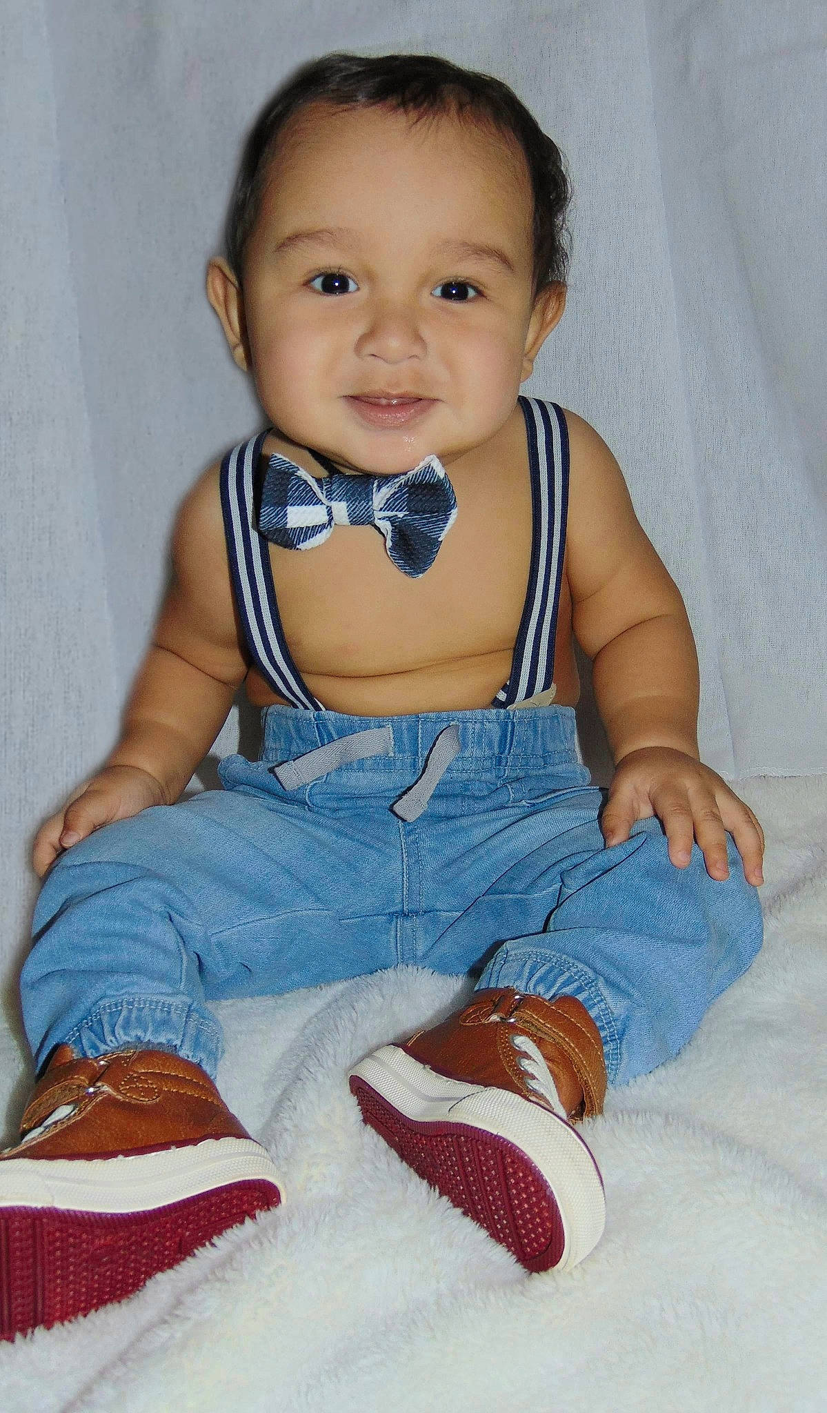 Mateo is registered to the contest to win money with this photo: arm, azure, baby, baby_toddler_clothing, cheek, child, dress, eye, finger, hair, happy, iris, joy, person, product, skin, sleeve, smile, standing, textile