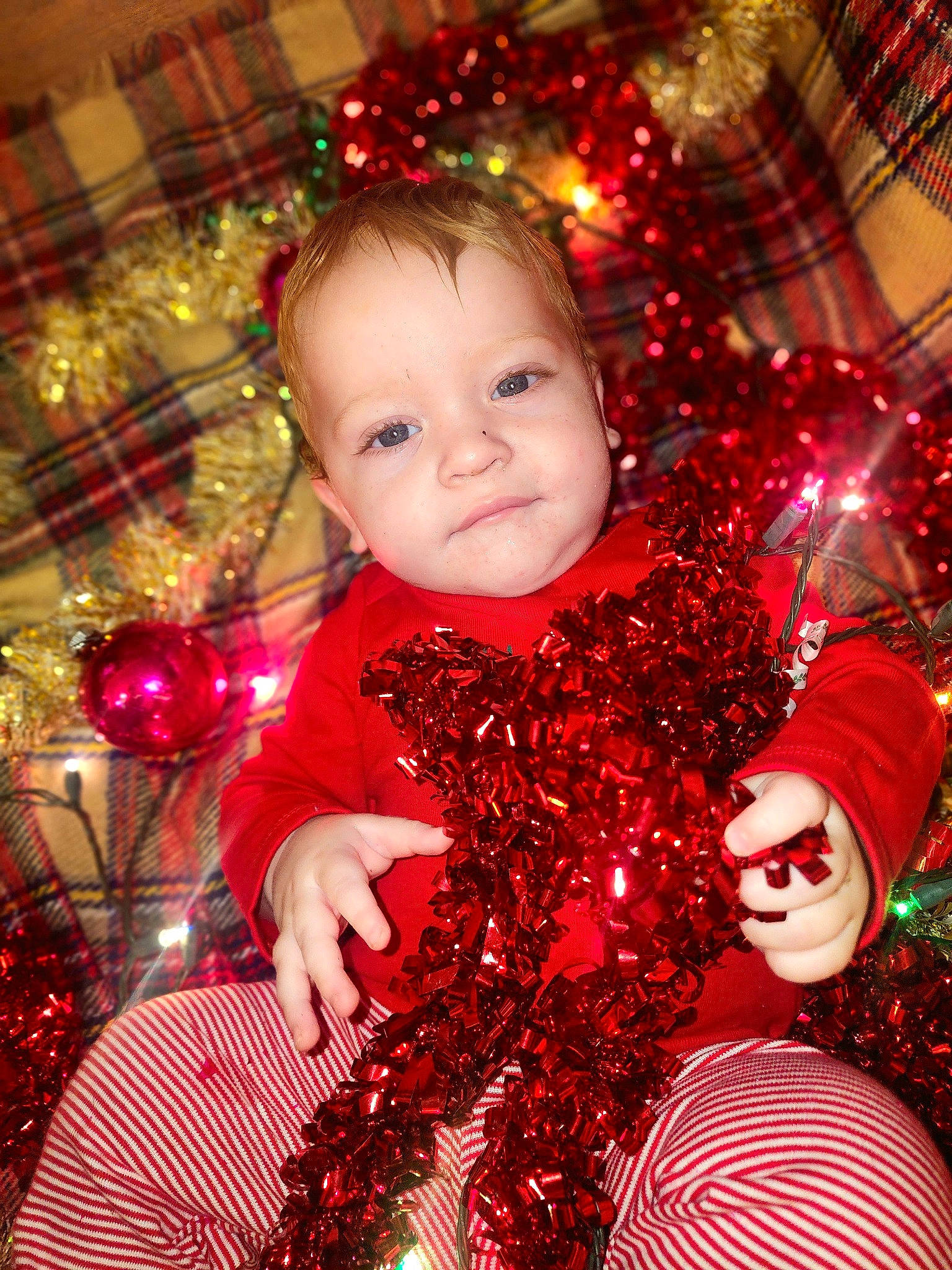 Dominick is registered to the contest to win money with this photo: child, christmas, christmas_decoration, christmas_eve, christmas_lights, christmas_ornament, christmas_tree, decoration, event, fun, happy, holiday, holiday_ornament, interior_design, light, ornament, person, red, toddler, tradition