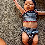 Gigi joined the competition — help win amazing prizes! arm, baby, barefoot, bow, carpet, checkered, child, clothing, cute, expression, floor, headband, indoor, infant, legs, lying_down, pattern, playful, skin, smiling