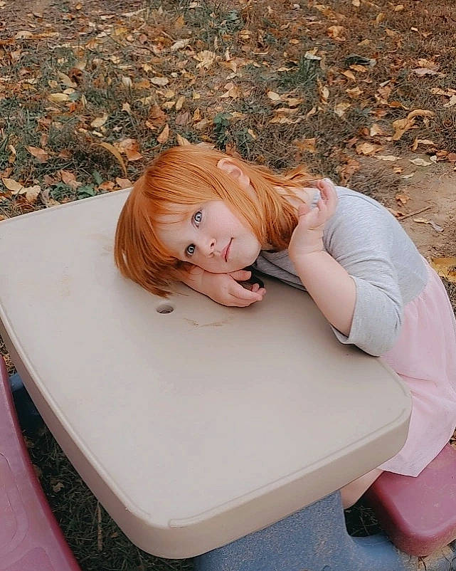 Maci joined the competition — help win amazing prizes! bench, blond, brown_hair, comfort, eyewear, grass, hair, hairstyle, happy, human_leg, knee, leisure, long_hair, outdoor_furniture, people_in_nature, person, plant, sitting, table, thigh