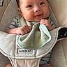 Elijah is registered to the contest to win money with this photo: baby, infant, smiling, babybjorn, carrier, clothing, green_cloth, chubby_cheeks, cute, happy, indoor, person, child, seated, soft_toy, closeup, portrait, hands, legs, skin