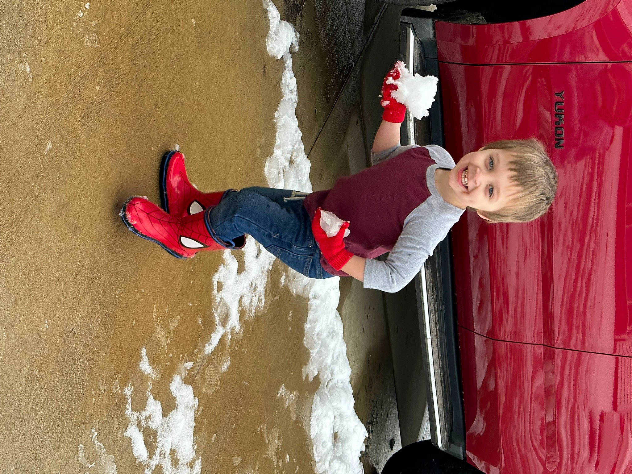 Jeremiah is registered to the contest to win money with this photo: adventure, carmine, child, flower, fun, happy, joy, leisure, person, plant, recreation, red, smile, toddler, walking_shoe, water