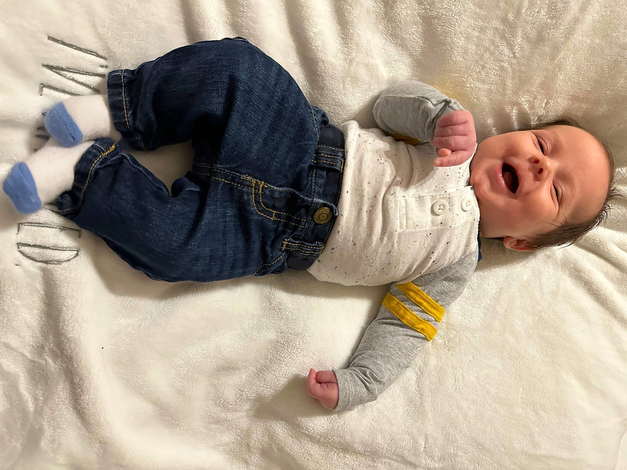 David is registered to the contest to win money with this photo: baby, baby_toddler_clothing, child, comfort, denim, flooring, fur, human_leg, knee, linens, nap, pattern, person, sitting, sleep, sleeve, smile, thigh, toddler, wood