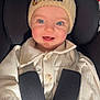baby, child, smiling, hat, pom_pom, mickey_mouse, car_seat, seatbelt, clothing, cream_color, blue_eyes, face, happy, infant, person, portrait, cute, warm_clothes, indoor, closeup