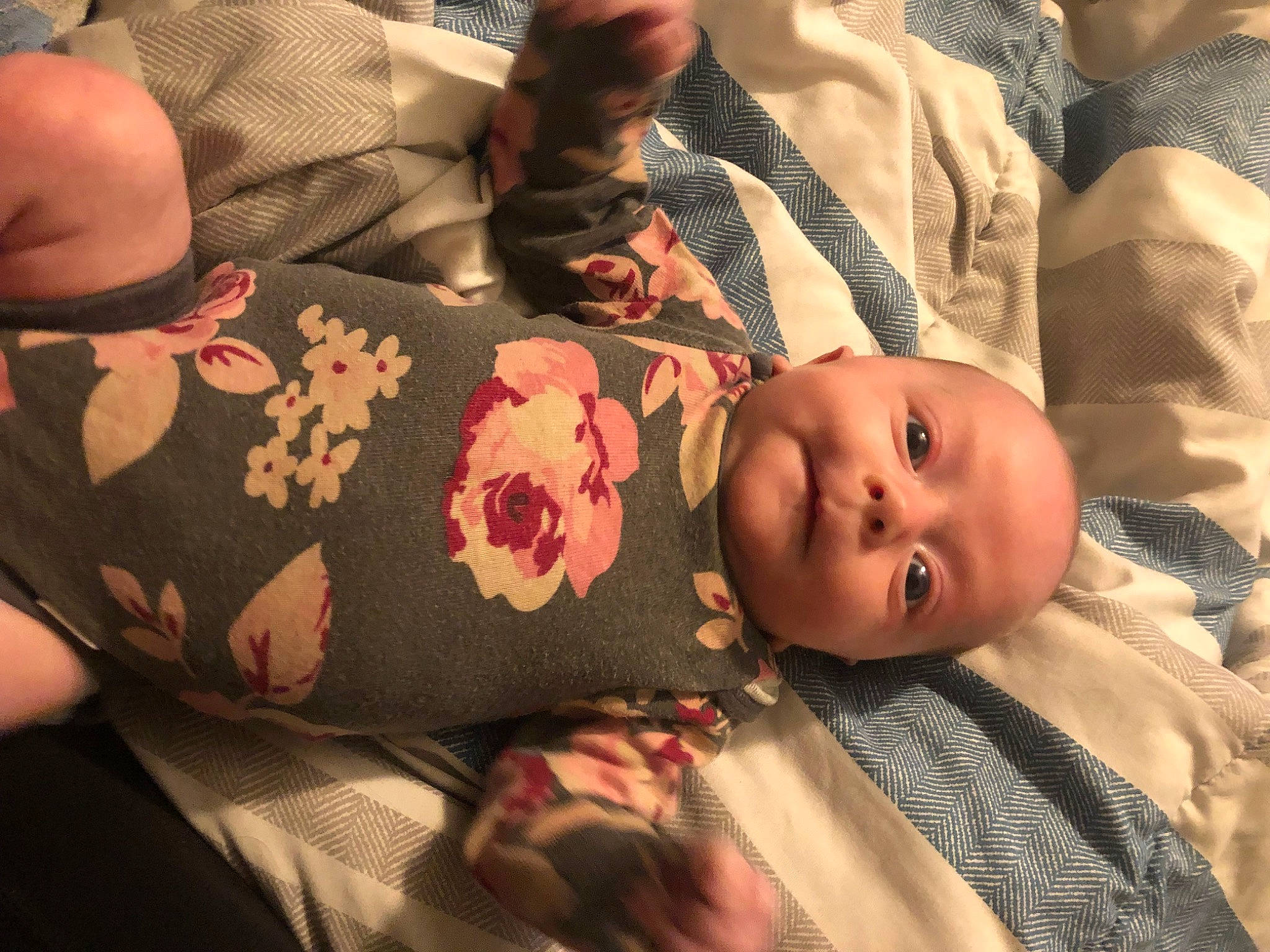 Freyja is registered to the contest to win money with this photo: baby, baby_toddler_clothing, cheek, chest, child, comfort, elbow, eye, finger, head, human_body, linens, mammal, mouth, pattern, person, skin, sleeve, toddler, trunk