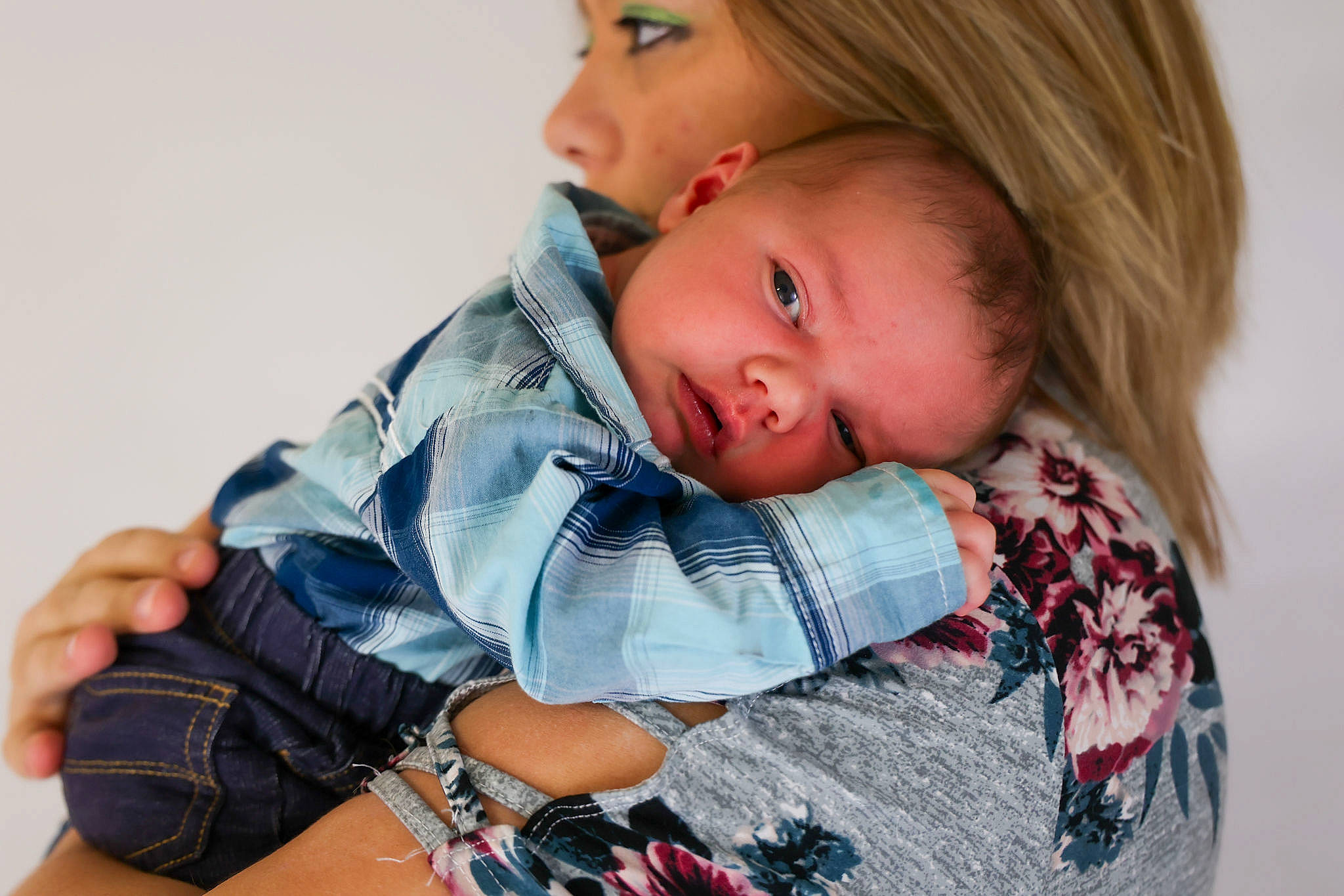 Brian is registered to the contest to win money with this photo: baby, baby_products, baby_toddler_clothing, blond, cheek, child, comfort, eye, face, gesture, happy, lip, neck, pattern, person, plaid, shoulder, sitting, skin, sleeve