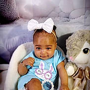 Aaliyah Taylor is registered to the contest to win money with this photo: baby, child, bow, blue_clothing, bunny_design, chair, cute, daisy_sunglasses, fluffy, girl, plush_toy, portrait, sitting, soft_texture, white_bow, white_chair, white_socks, adorable, indoor, infant