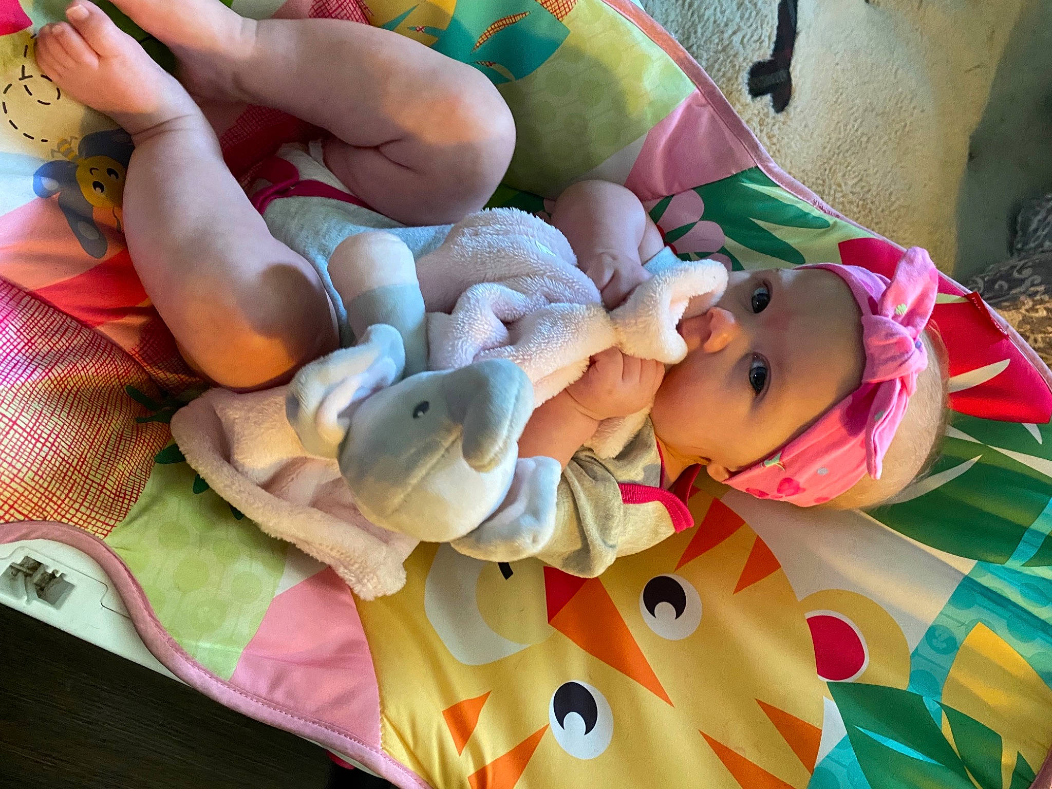 Brynn is registered to the contest to win money with this photo: art, baby, baby_products, baby_toddler_clothing, bed_sheet, bedding, bedtime, child, comfort, event, happy, headwear, linens, pattern, peach, person, plush, room, smile, stuffed_toy