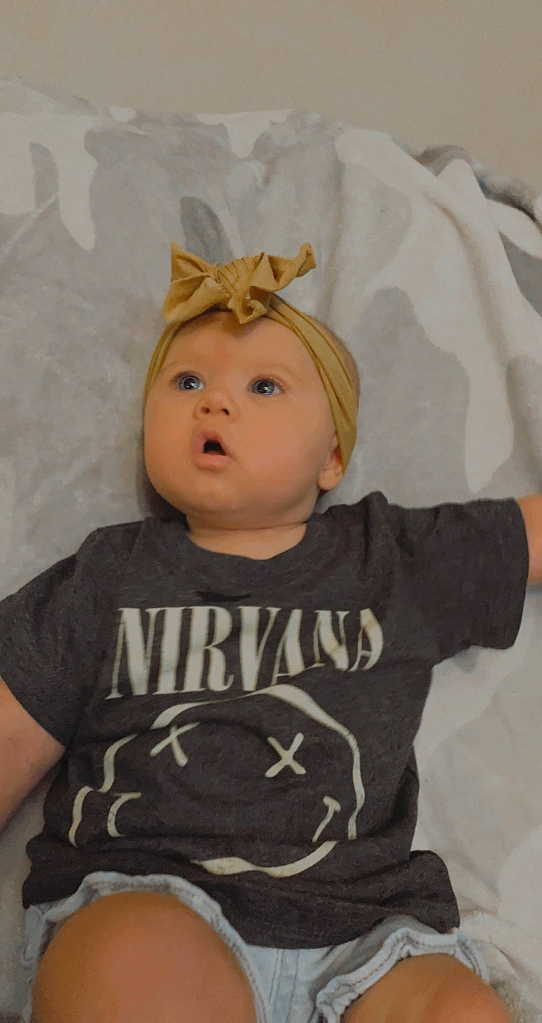 Brynn is registered to the contest to win money with this photo: baby, baby_toddler_clothing, cheek, child, comfort, cool, costume_hat, eye, eyelash, face, gesture, hair, happy, headpiece, human_body, long_sleeved_t_shirt, person, product, sleeve, t_shirt