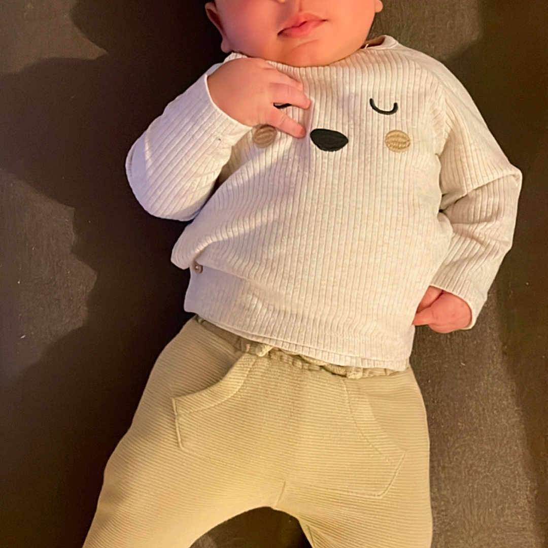 Sanad participe au concours pour gagner de l'argent avec cette photo : baby, bodypart, clothing, coat, face, finger, hand, head, hosiery, knitwear, longsleeve, pants, person, photography, portrait, shirt, shorts, sleeve, sock, sweater