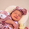 Dakota joined the competition — help win amazing prizes! newborn, baby, infant, sleeping, portrait, pink, satin, bow, headband, dress, blanket, plush_toy, bunny, rubber_duck, toy, knitted_blanket, lying_down, indoors, close_up, cute