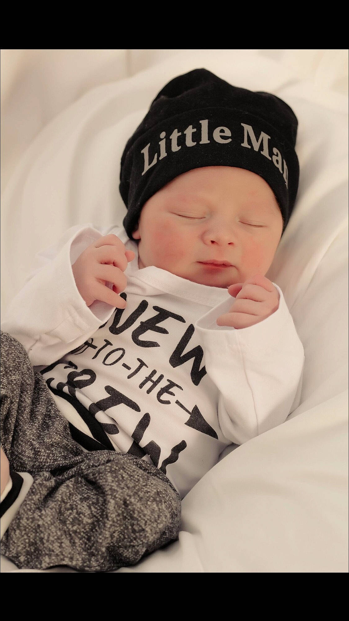 George is registered to the contest to win money with this photo: baby, beanie, bonnet, cap, child, headgear, knit_cap, person, toddler