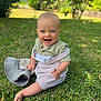 Lucien a rejoint le concours — aidez-le/la à gagner de superbes lots ! baby, child, grass, outdoor, smiling, hat, greenery, happy, sitting, nature, portrait, cute, one_person, daylight, casual_clothing, head, face, barefoot, summer, playful