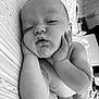 baby, sleeping, hands, face, infant, bed, blanket, pattern, black_and_white, skin, peaceful, resting, chubby, cute, portrait, indoors, closeup, naptime, calm, child