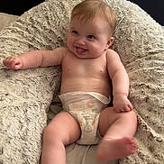 Aiyla joined the competition — help win amazing prizes! baby, diaper, infant, cushion, fluffy, bed, playful, tongue_out, skin, person, smiling, happy, cute, sitting, indoors, comfort, soft, head, legs, arms