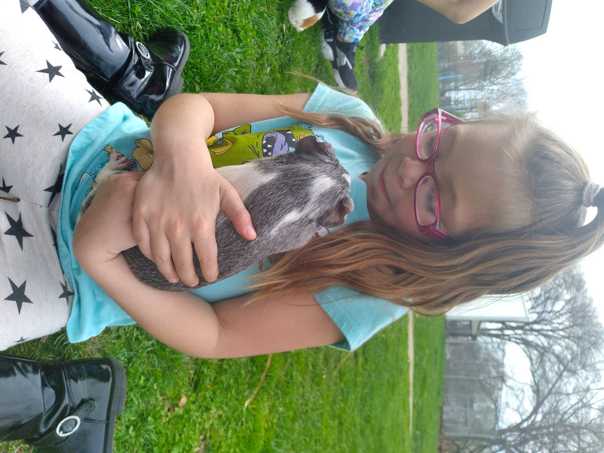 Karlee joined the competition — help win amazing prizes! bag, cool, event, eyewear, fashion_accessory, fun, grass, green, happy, human_leg, leisure, luggage_and_bags, person, plant, recreation, sandal, sitting, summer, thigh, tree