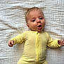 Lucas joined the competition — help win amazing prizes! baby, blanket, child, cozy, cute, expression, face, hands, head, human, indoor, infant, lying_down, newborn, one_person, portrait, sleepwear, soft_texture, yellow_onesie, young_child