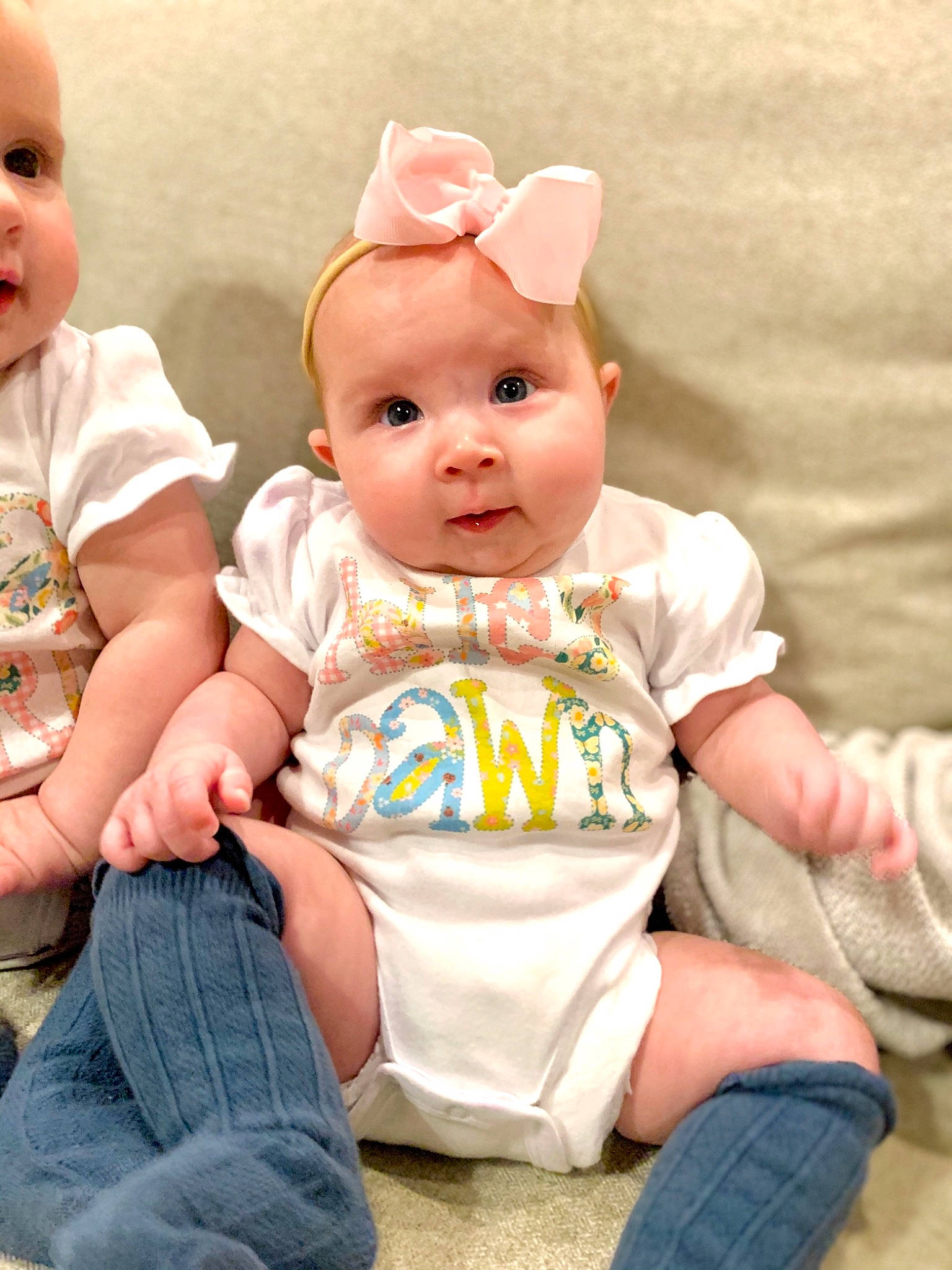 Adley joined the competition — help win amazing prizes! baby, baby_toddler_clothing, cheek, child, chin, clothing, doll, dress, eye, finger, happy, joint, person, pink, sitting, skin, sleeve, standing, t_shirt, textile