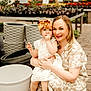 Diem joined the competition — help win amazing prizes! child, woman, flower_pots, greenhouse, plants, flowers, garden, toddler, bow, dress, sandals, smile, outdoor, nature, portrait, candid, happy, person, holding, family