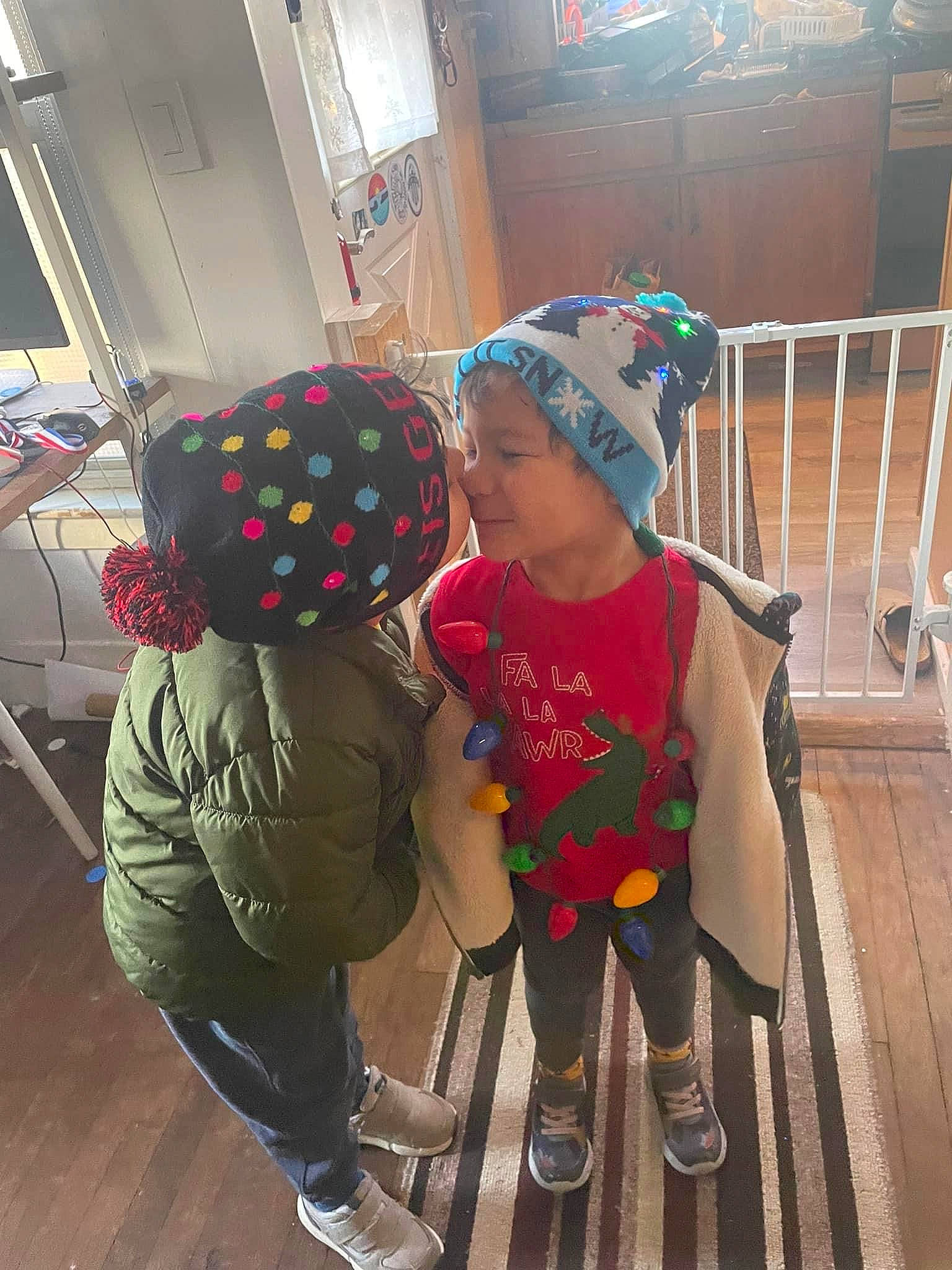 Anthony joined the competition — help win amazing prizes! baby_toddler_clothing, cap, child, floor, flooring, fun, headgear, headwear, leisure, pattern, person, personal_protective_equipment, play, room, sandal, shoe, sitting, sneakers, standing, toddler