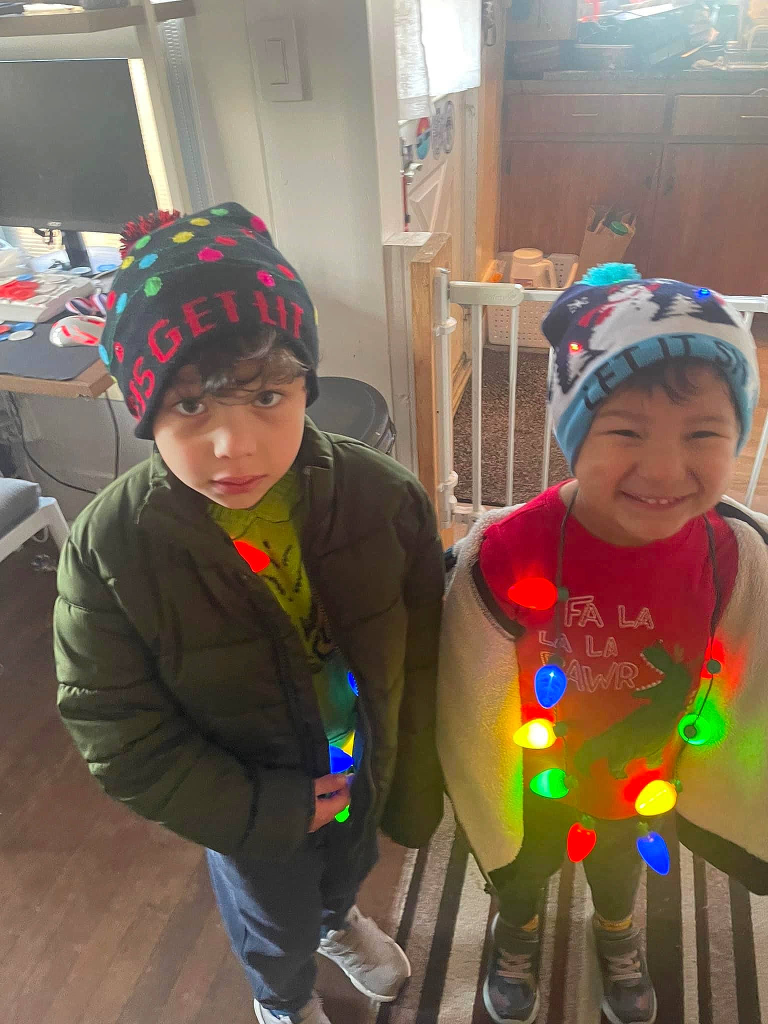 Anthony is registered to the contest to win money with this photo: boot, cap, child, costume, event, flooring, fun, happy, headwear, holiday, hoodie, jacket, joy, kindergarten, leg, leisure, person, personal_protective_equipment, play, room