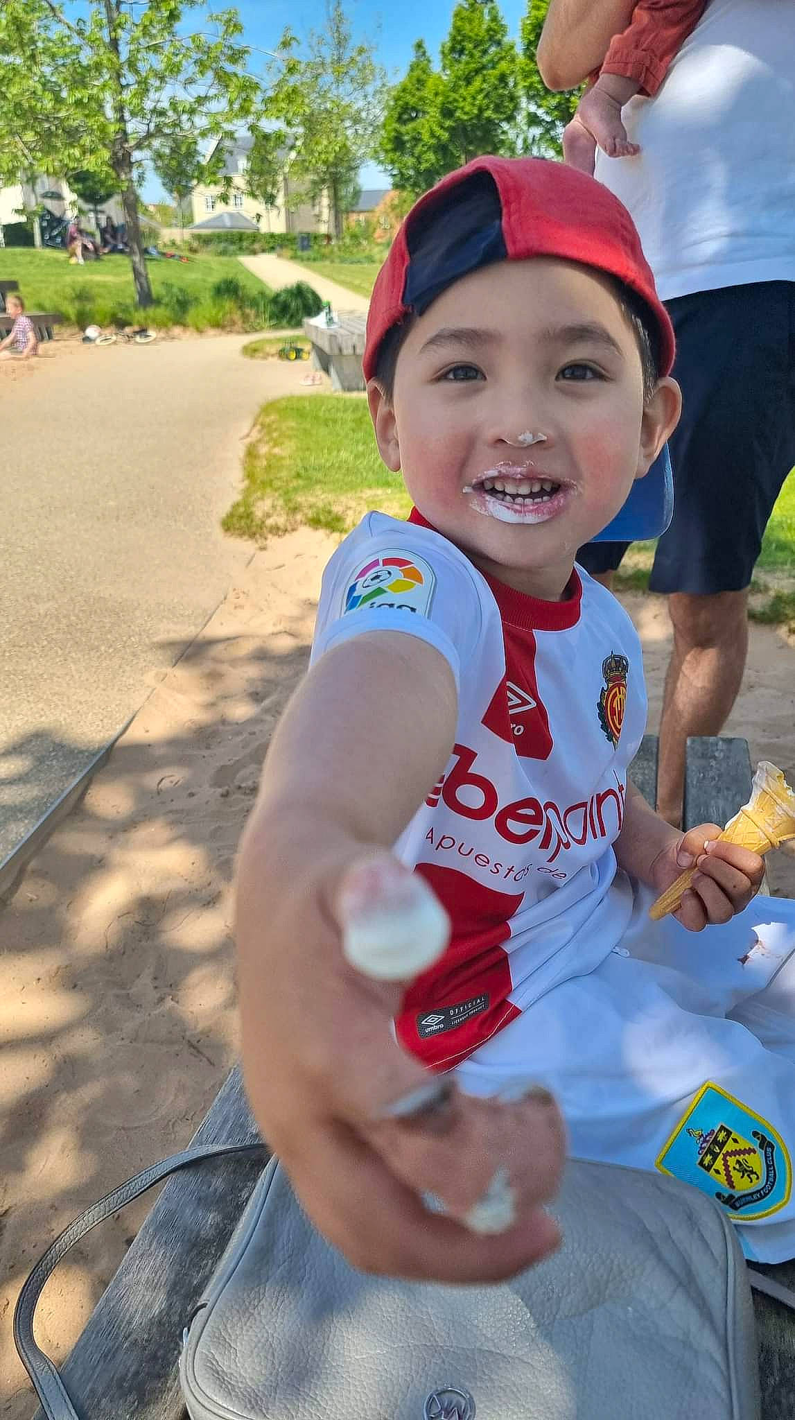 Alonzo is registered to the contest to win money with this photo: athlete, baseball_cap, bicycle_clothing, child, competition_event, cycling, electric_blue, endurance_sports, fun, happy, headwear, joy, leisure, marathon, person, personal_protective_equipment, plant, racing, recreation, smile