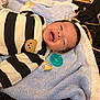 Noah joined the competition — help win amazing prizes! baby, infant, smiling, striped_clothing, blanket, pacifier, soft_texture, cute, lying_down, happy, face, child, indoors, cozy, black_and_white, plush, warm, small, adorable, comfort