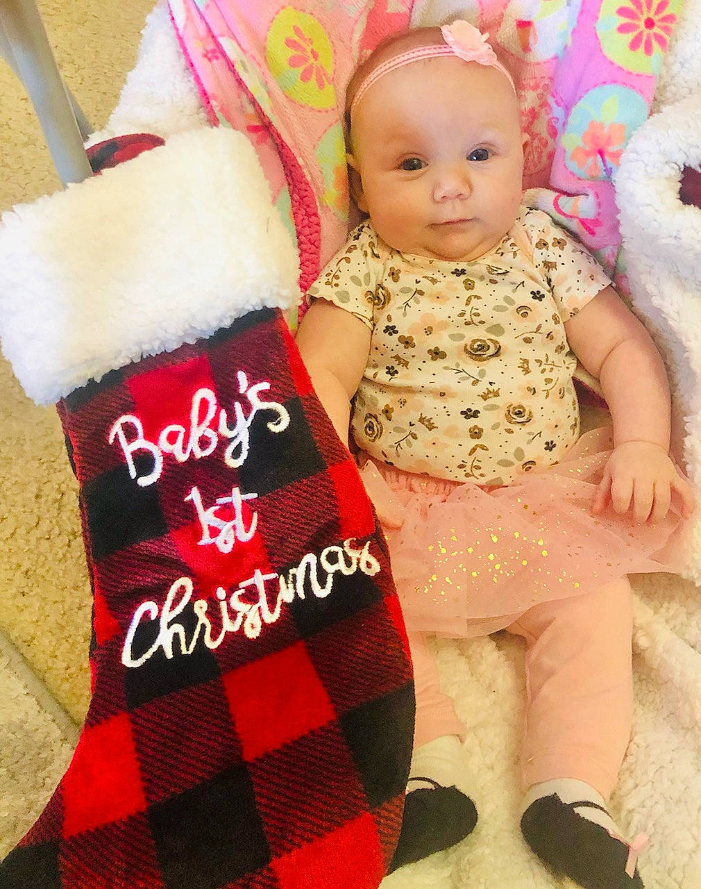 Alyaa is registered to the contest to win money with this photo: baby, baby_toddler_clothing, clothing, doll, dress, finger, hand, human_body, leg, person, pink, red, shoe, skin, sleeve, sock, tartan, thigh, toddler, toy