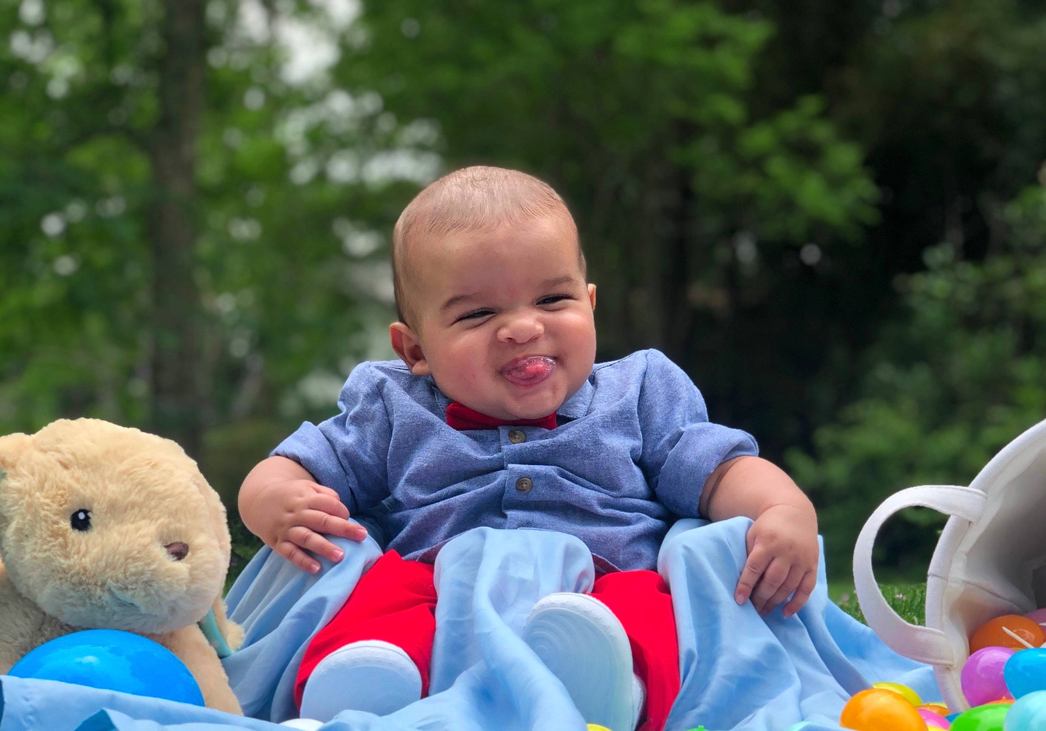 Kohen is registered to the contest to win money with this photo: baby, baby_products, baby_toys, blue, child, fun, grass, leisure, organism, people, person, photography, play, product, sitting, skin, stuffed_toy, summer, toddler, toy