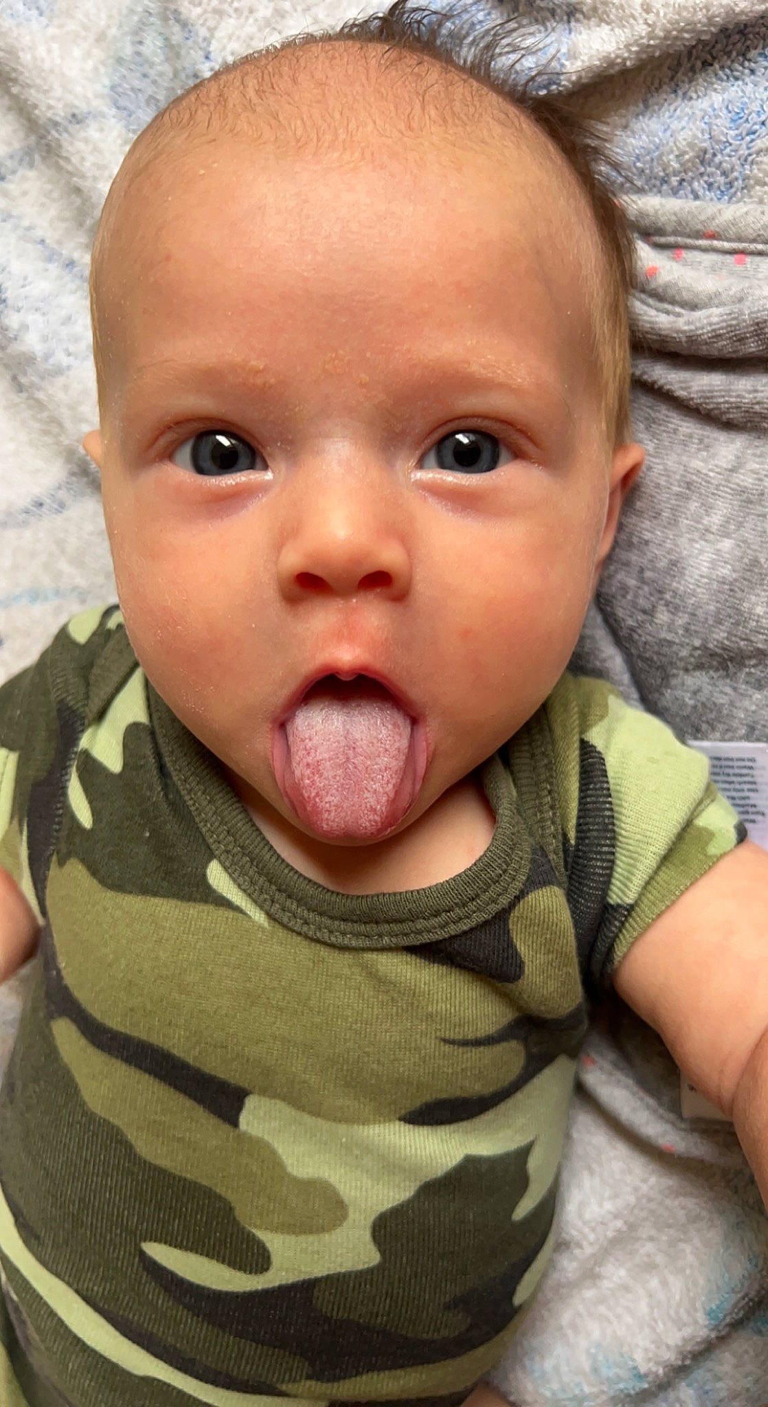 Georgia is registered to the contest to win money with this photo: baby, baby_toddler_clothing, cheek, comfort, ear, eyebrow, eyelash, finger, gesture, happy, iris, lip, mouth, neck, nose, person, skin, sleeve, surprise, thumb