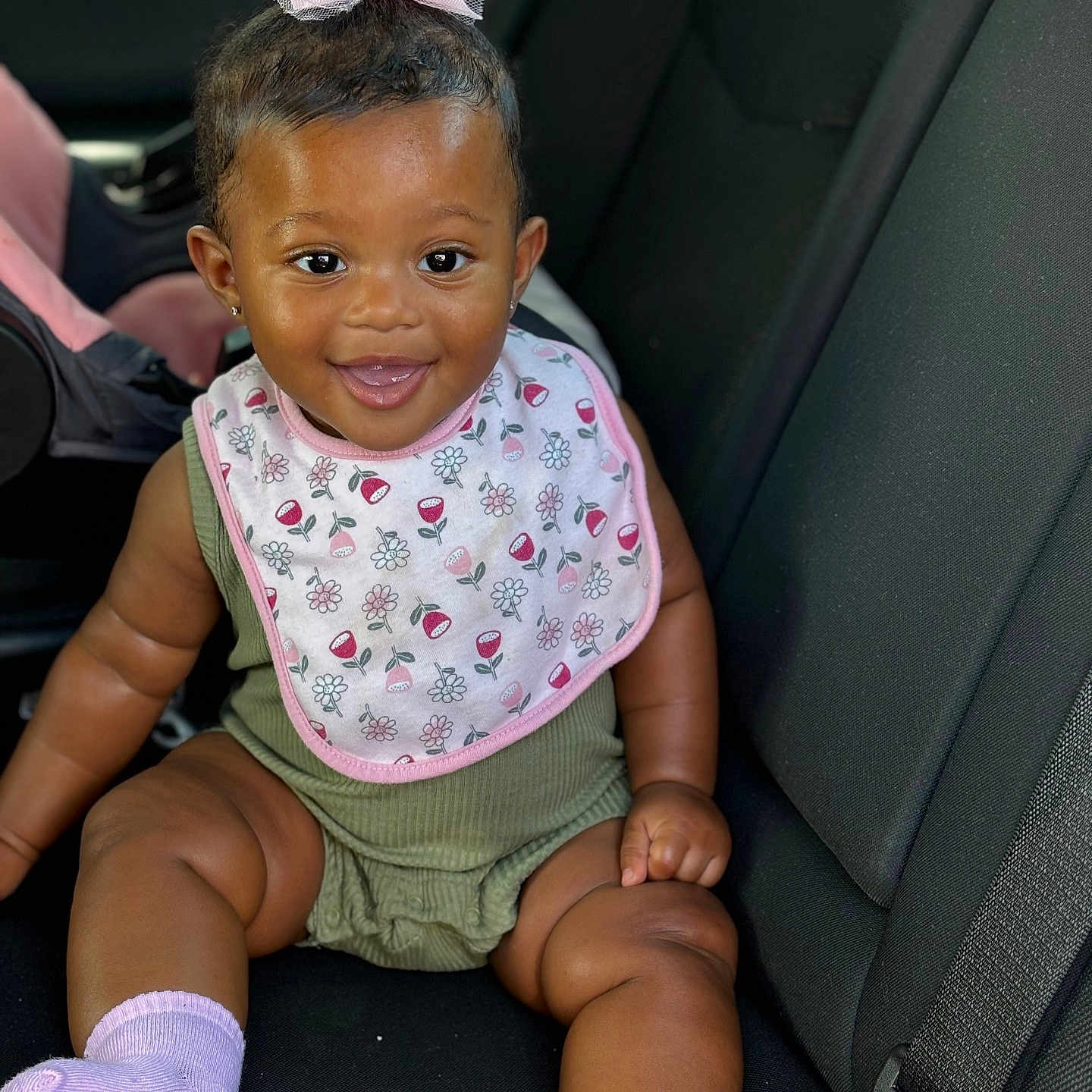 Empress is registered to the contest to win money with this photo: accessories, baby, car, car_interior, carseat, clothing, cushion, diaper, dress, face, head, homedecor, hosiery, person, photography, portrait, shorts, sitting, sock, transportation