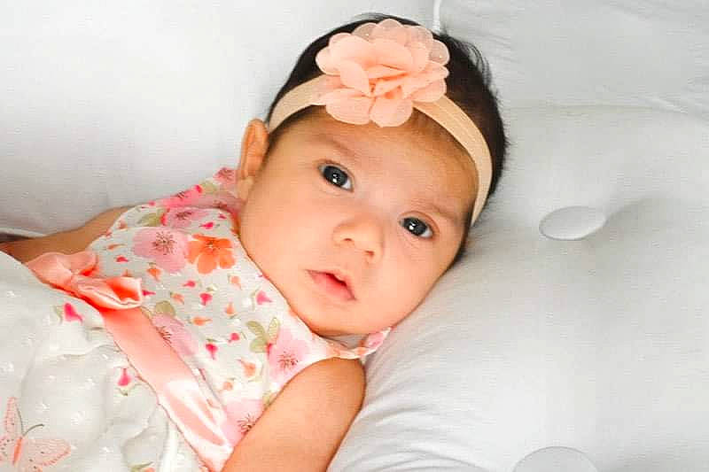 Amaris is registered to the contest to win money with this photo: baby, beauty, cheek, child, ear, eye, face, hair_accessory, head, headband, headgear, headpiece, headwear, lip, nose, person, photography, pink, product, skin