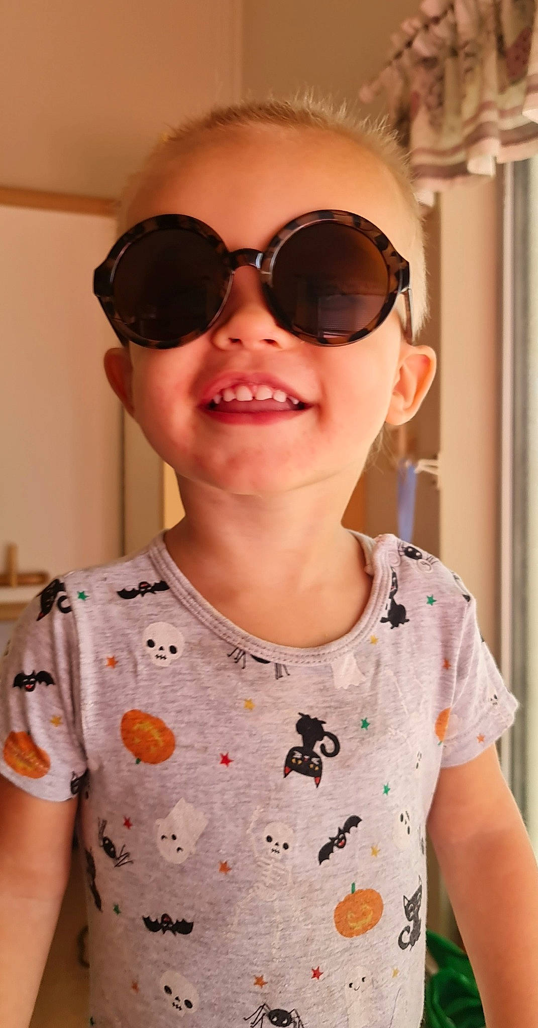 Lochlan is registered to the contest to win money with this photo: baby_toddler_clothing, cheek, cool, eyebrow, eyewear, glasses, goggles, hair, happy, head, joy, lip, neck, nose, person, pink, skin, sleeve, smile, sunglasses