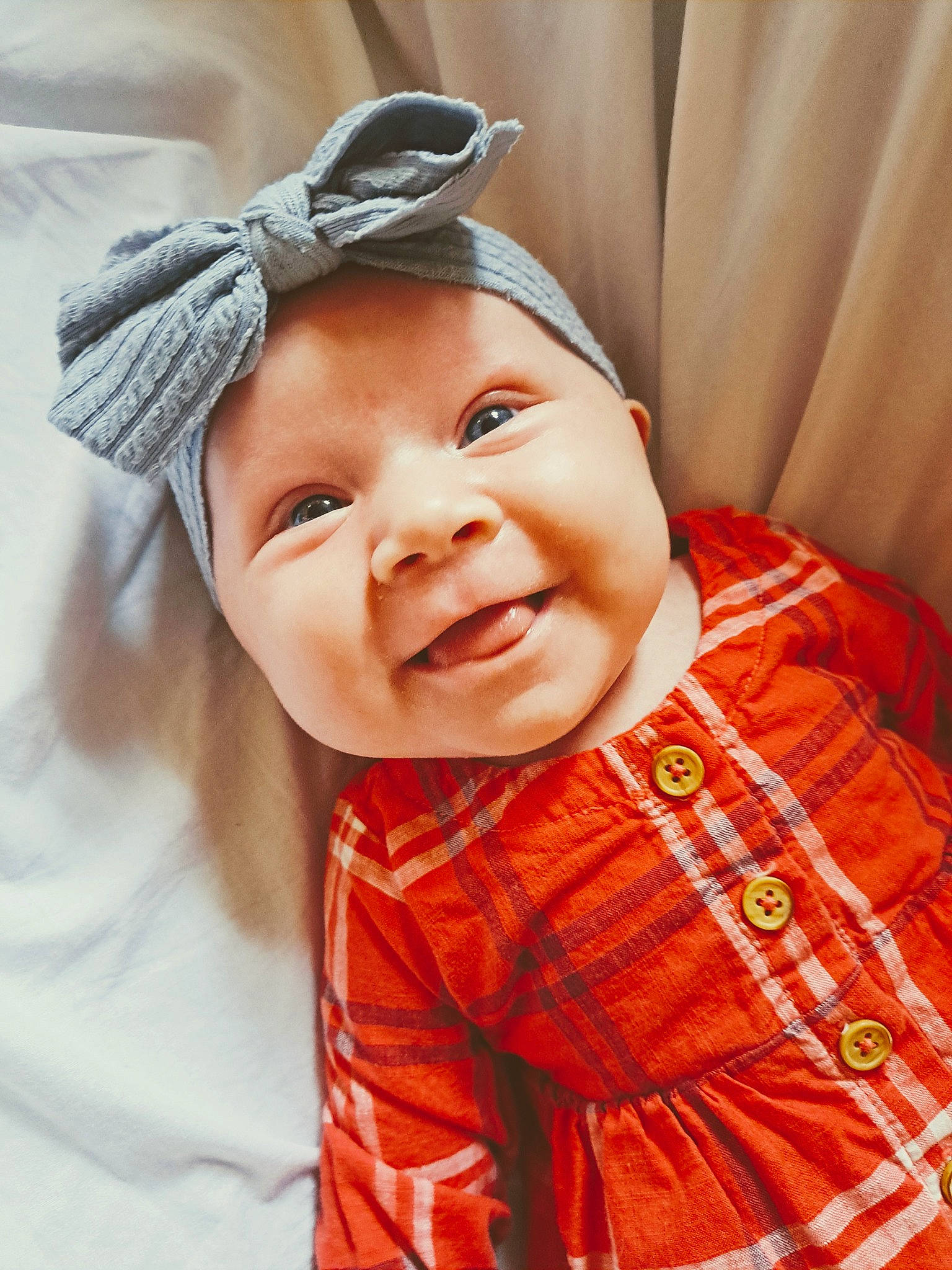 Charleigh is registered to the contest to win money with this photo: baby, baby_laughing, baby_toddler_clothing, child, event, eye, eyebrow, fashion_accessory, fun, happy, hat, head, headwear, laugh, pattern, person, plaid, skin, sleeve, smile
