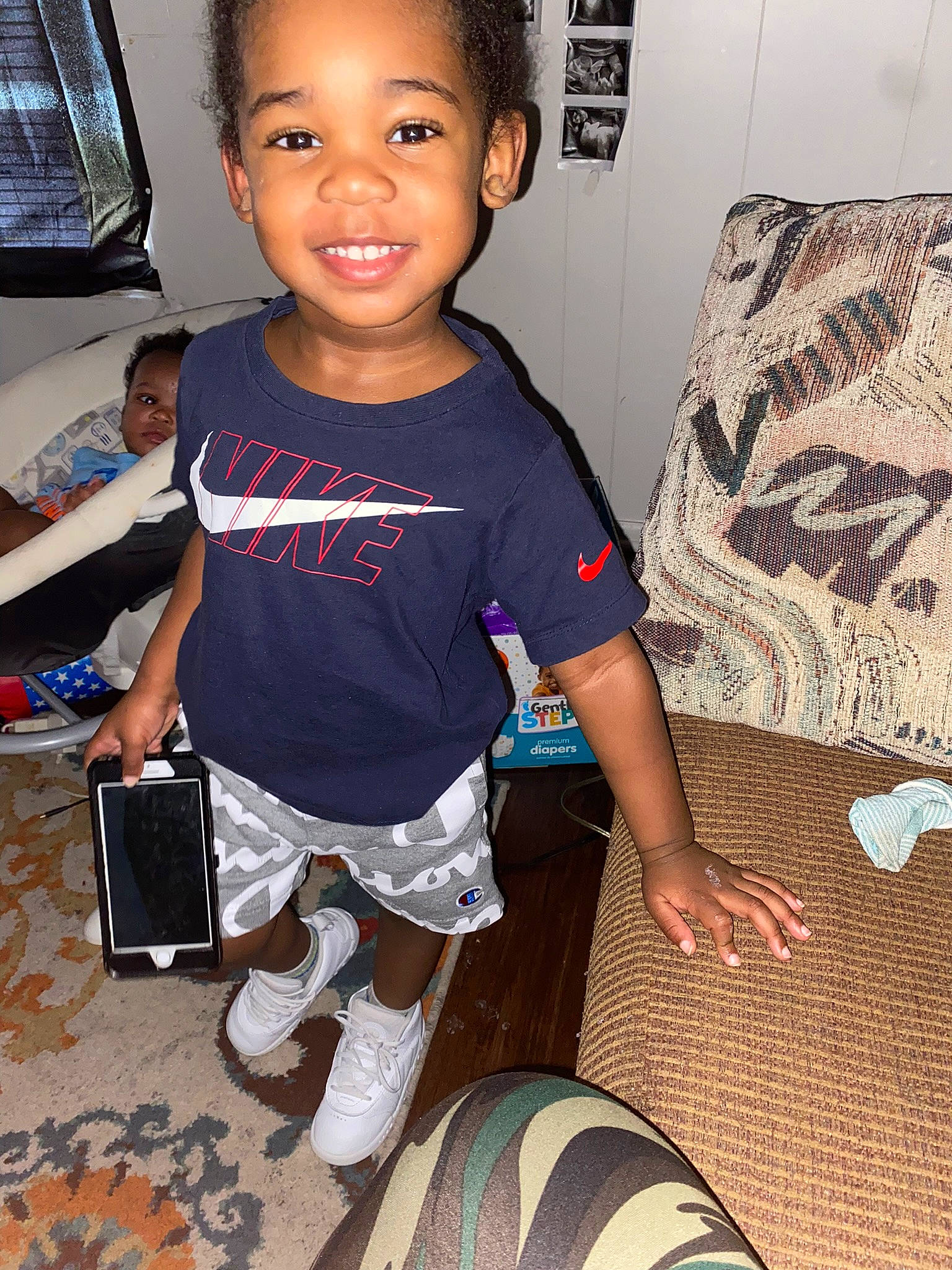 Khaius joined the competition — help win amazing prizes! baby_toddler_clothing, black, child, cool, finger, flooring, fun, hairstyle, happy, human_leg, joint, joy, knee, leg, person, sleeve, smile, snapshot, sock, t_shirt